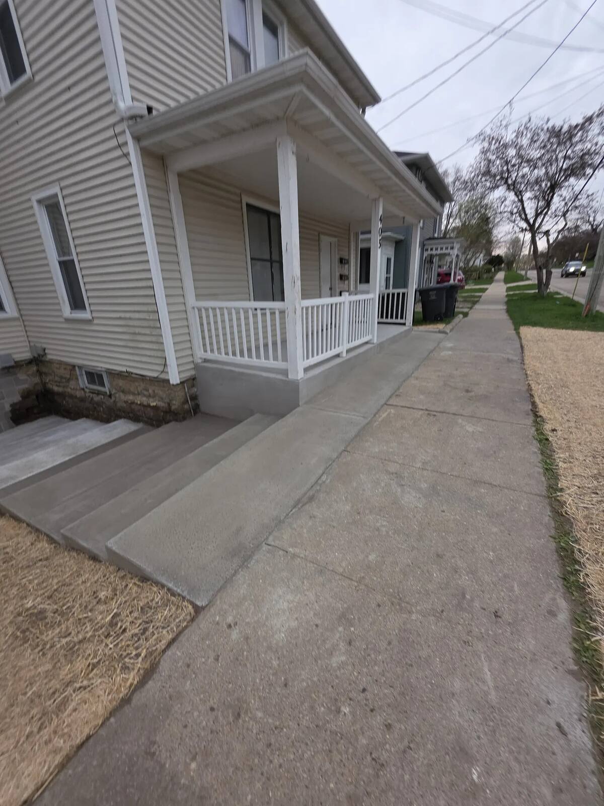 New concrete steps, stoop and walkway at a front porch